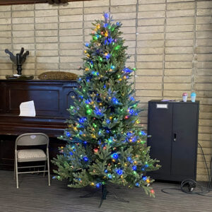 A Christmas tree decorated with colorful lights.