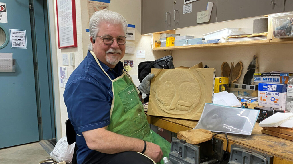 Daniel Roth is carving a sleeping bear cub.